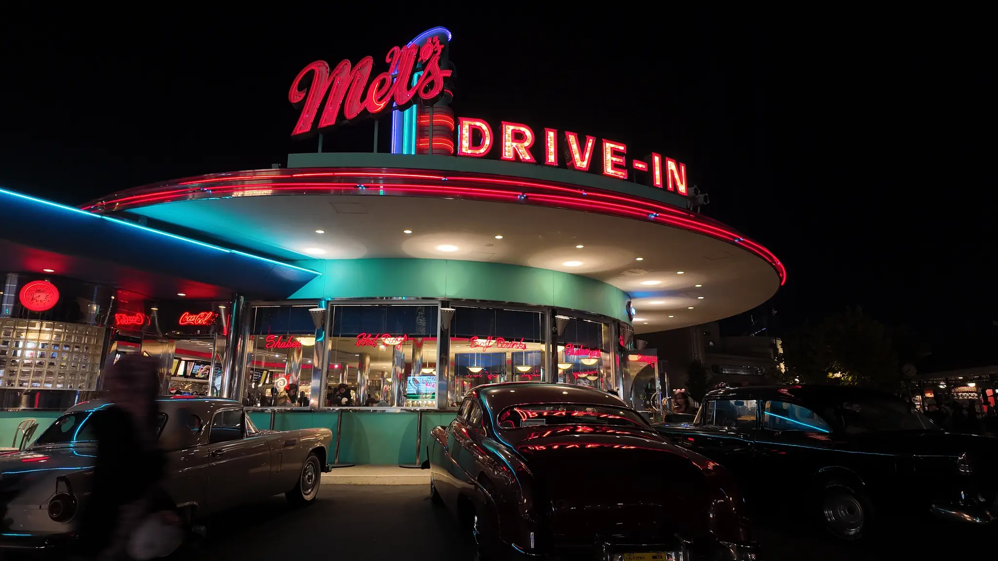 Mel's Drive-In glowing in neon at night